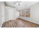 Bedroom featuring neutral walls, wood look flooring, and multiple windows at 1331 Penhurst Dr, Lawrenceville, GA 30043