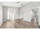 Spacious bedroom featuring high ceiling, light grey walls, and wood-look flooring at 1331 Penhurst Dr, Lawrenceville, GA 30043