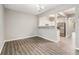 Bright dining room with wood-look flooring and stainless steel refrigerator at 1331 Penhurst Dr, Lawrenceville, GA 30043