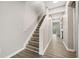 Hallway with wood flooring, staircase, and neutral walls at 1331 Penhurst Dr, Lawrenceville, GA 30043