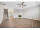 Bright living room with fireplace, ceiling fan, and stairs at 1331 Penhurst Dr, Lawrenceville, GA 30043