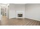 Cozy living room featuring a fireplace, neutral walls, and modern flooring at 1331 Penhurst Dr, Lawrenceville, GA 30043