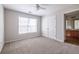 A spacious bedroom featuring plush carpeting, neutral colors, and a large window at 134 Turman Se Ave, Atlanta, GA 30315