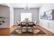 Bright dining room featuring hardwood floors, neutral colors, stylish furniture, and modern decor at 134 Turman Se Ave, Atlanta, GA 30315