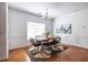 Bright dining room featuring hardwood floors, neutral colors, stylish furniture, and modern decor at 134 Turman Se Ave, Atlanta, GA 30315