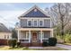 Charming two-story home with a classic covered porch and well-manicured landscaping at 134 Turman Se Ave, Atlanta, GA 30315