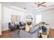 Bright living room with a ceiling fan, hardwood floors, neutral colors, and stylish furniture at 134 Turman Se Ave, Atlanta, GA 30315