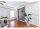 Stylish living room with hardwood floors, a unique accent wall, and plenty of natural light at 134 Turman Se Ave, Atlanta, GA 30315