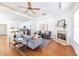 Inviting living room with a fireplace, hardwood floors, and an open layout connecting to the kitchen at 134 Turman Se Ave, Atlanta, GA 30315