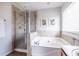 A soothing bathroom with a soaking tub and glass-enclosed shower at 134 Turman Se Ave, Atlanta, GA 30315