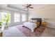 Bright and airy main bedroom featuring carpet, tray ceiling and large windows offering natural light at 134 Turman Se Ave, Atlanta, GA 30315