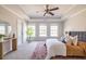 This main bedroom features tray ceilings, neutral walls and trim, and a large rug at 134 Turman Se Ave, Atlanta, GA 30315