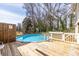 Backyard in-ground pool with wooden deck, perfect for summer relaxation and outdoor entertainment at 134 Turman Se Ave, Atlanta, GA 30315