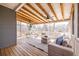 Relax in style on this screened porch with wood floors, ceiling fans, and comfortable seating at 134 Turman Se Ave, Atlanta, GA 30315