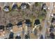 Aerial view of neighborhood homes, displaying manicured lawns and tree coverage at 2124 Mitford Ct, Dacula, GA 30019