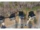 An aerial view displays the neighborhood homes in a wooded area, with driveways and landscaping visible at 2124 Mitford Ct, Dacula, GA 30019