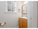 Bathroom vanity with wood cabinet at 2124 Mitford Ct, Dacula, GA 30019