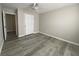 Bedroom featuring laminate floors, neutral paint, and ceiling fan at 2124 Mitford Ct, Dacula, GA 30019