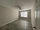 Bedroom features light-colored walls and neutral colored flooring at 2124 Mitford Ct, Dacula, GA 30019