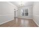 Elegant dining room featuring large windows and hardwood floors at 2124 Mitford Ct, Dacula, GA 30019