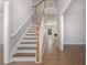 Inviting foyer with hardwood floors and staircase to the second floor at 2124 Mitford Ct, Dacula, GA 30019