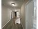 Upstairs hallway with laminate floors and access to bedrooms at 2124 Mitford Ct, Dacula, GA 30019