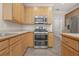 Updated kitchen featuring stainless steel appliances, plentiful cabinetry, and sleek countertops at 2124 Mitford Ct, Dacula, GA 30019