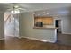 Spacious living room flows into the kitchen, featuring hardwood floors and neutral paint at 2124 Mitford Ct, Dacula, GA 30019