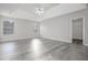 Spacious main bedroom with a tray ceiling, ceiling fan, and large windows at 2124 Mitford Ct, Dacula, GA 30019