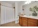 Cozy bathroom with light wood cabinets and granite countertop at 2752 Middlecreek Way, Cumming, GA 30041