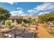 Large community gardens with a playhouse and gravel walkways at 2752 Middlecreek Way, Cumming, GA 30041