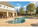 Community pool with lounge chairs, lush landscaping, and building in background at 2752 Middlecreek Way, Cumming, GA 30041