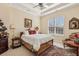 Bedroom with a queen size bed, neutral carpet and tray ceilings at 891 Legacy Woods Dr, Norcross, GA 30093