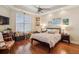 Inviting bedroom with hardwood floors, natural light, and a cozy atmosphere at 891 Legacy Woods Dr, Norcross, GA 30093