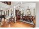 Formal dining room with hardwood floors, elegant chandelier, and ample space for entertaining at 891 Legacy Woods Dr, Norcross, GA 30093