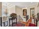 Hallway with chandelier and decorative bannister overlooking foyer at 891 Legacy Woods Dr, Norcross, GA 30093