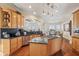 Well-lit kitchen with granite countertops, stainless steel appliances, and island with cooktop at 891 Legacy Woods Dr, Norcross, GA 30093