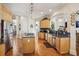 Open kitchen layout with island cooktop, stainless appliances, and ample counter space at 891 Legacy Woods Dr, Norcross, GA 30093