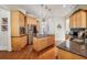 Spacious kitchen with wood cabinetry, granite countertops, and stainless steel appliances at 891 Legacy Woods Dr, Norcross, GA 30093