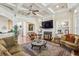 Cozy living room with fireplace, built-in shelves, ceiling fan and decorative rug at 891 Legacy Woods Dr, Norcross, GA 30093