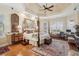 Spacious main bedroom featuring hardwood floors, ceiling fan, and an elegant decor at 891 Legacy Woods Dr, Norcross, GA 30093