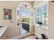 Bright sunroom with decorative windows and a tiled floor, creating a warm and inviting space at 1400 Monroe Dr, Atlanta, GA 30324