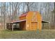 Rustic barn with a red roof, offering storage and space for animals at 4009 Highway 138 Sw, Stockbridge, GA 30281