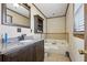 Bathroom featuring a combination shower and tub, toilet, and granite countertop vanity at 4009 Highway 138 Sw, Stockbridge, GA 30281