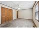 Bedroom showcasing wall-to-wall carpet, a ceiling fan, and a closet at 4009 Highway 138 Sw, Stockbridge, GA 30281