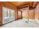 Bonus room with exposed framing, wood paneled walls, and French doors at 4009 Highway 138 Sw, Stockbridge, GA 30281