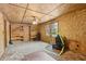 Bonus room featuring natural wood walls, built-in shelving, and ceiling fan at 4009 Highway 138 Sw, Stockbridge, GA 30281