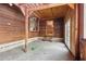 Bonus room featuring wood paneled walls, concrete floor, and rear yard access at 4009 Highway 138 Sw, Stockbridge, GA 30281