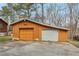 Detached two-car garage featuring two separate doors and a concrete driveway at 4009 Highway 138 Sw, Stockbridge, GA 30281