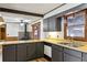 Kitchen featuring dark cabinets and a wood countertop at 4009 Highway 138 Sw, Stockbridge, GA 30281
